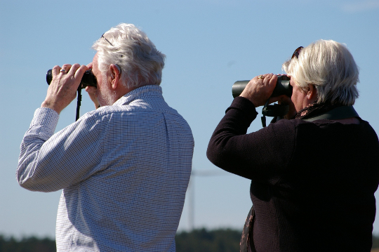 The Horrors and Gifts of Growing Older an older couple with binoculars